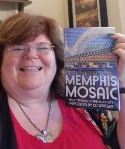 A closeup of the author holding the book, Memphis Mosaic.