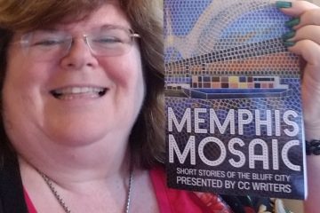 A closeup of the author holding the book, Memphis Mosaic.
