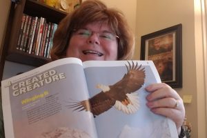 A photo of Annette Teepe holding Kids Answers up to show the article, Winging It