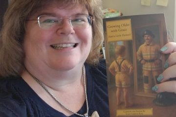 Annette Teepe holding the book, Growing Older with Grace (And a Little Humor)