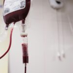 A setup for blood transfusion showing the bag of blood and tubes to bring blood to the patient