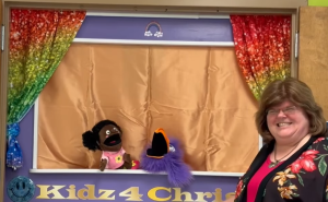 Preschool Puppet Stage with Annette Teepe, a puppet, and a bird.