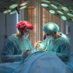two doctors performing surgery