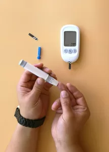 a person testing their blood sugar level