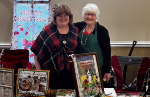 Annette Teepe and Pamela Ray at Legacy Cares Christmas Market author table