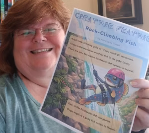 Annette Teepe holding her article in StarLight magazine.